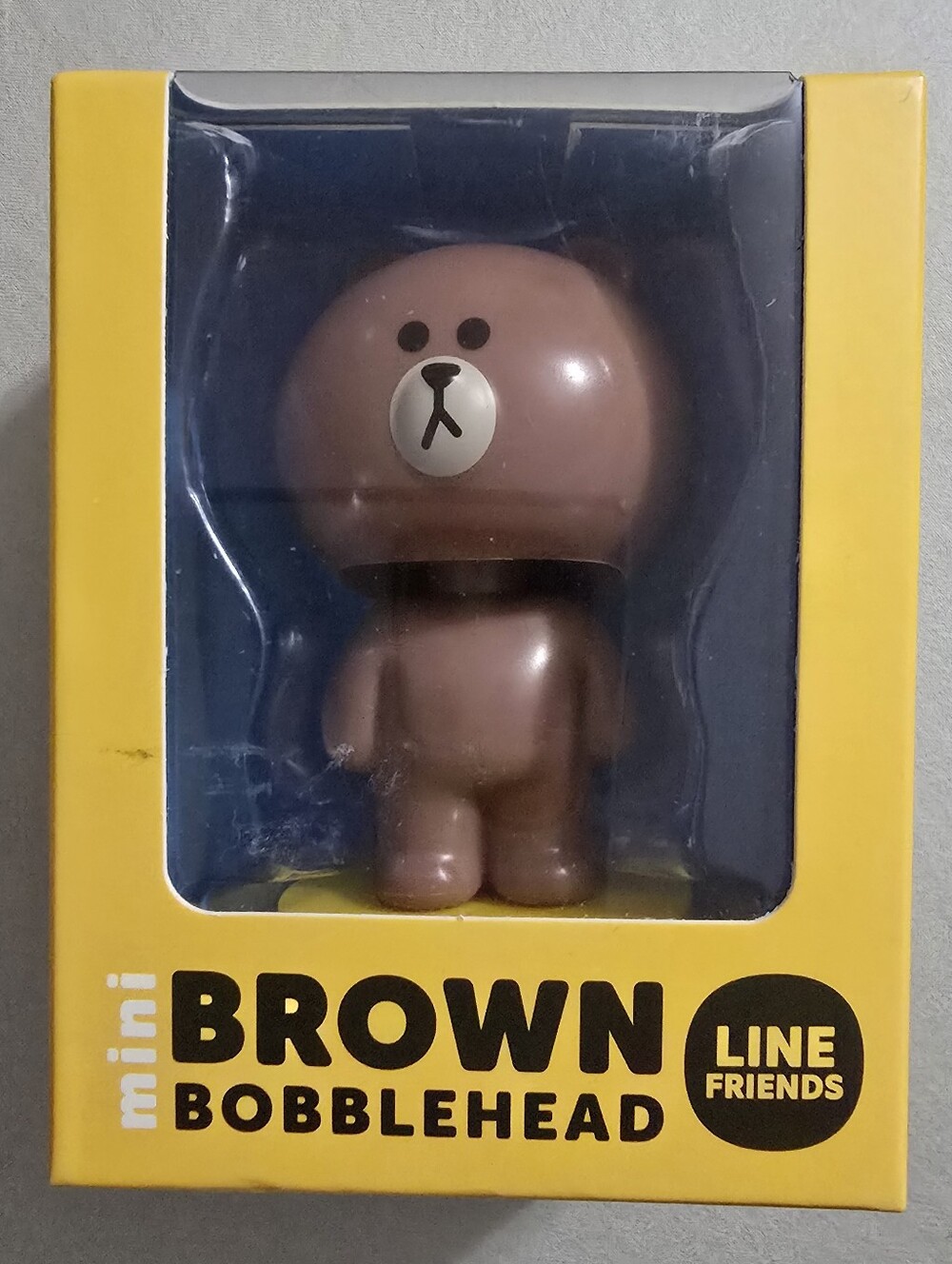 FRIENDS Brown Mini Bobblehead on Yellow Base With Mini Book